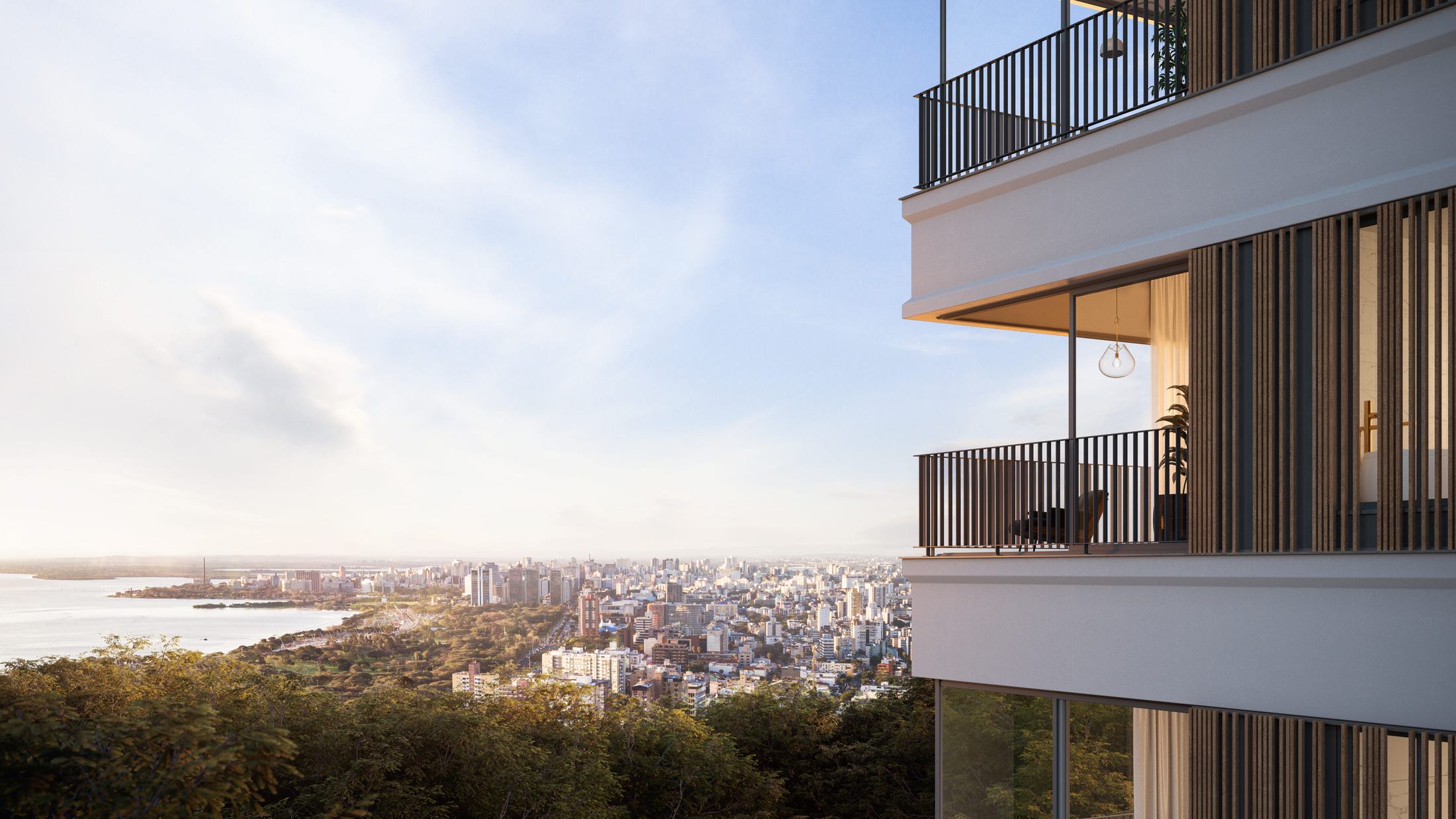 Perspectiva da fachada do Aria com varandas e painéis de madeira, de frente para a cidade e o Guaíba ao entardecer